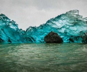 The source of the gorgeous hues on the bottom of an iceberg