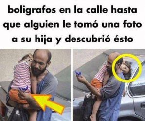 El hombre que vendía bolígrafos en la calle con su hija en brazos, hasta que alguien les tomo una fotografía.